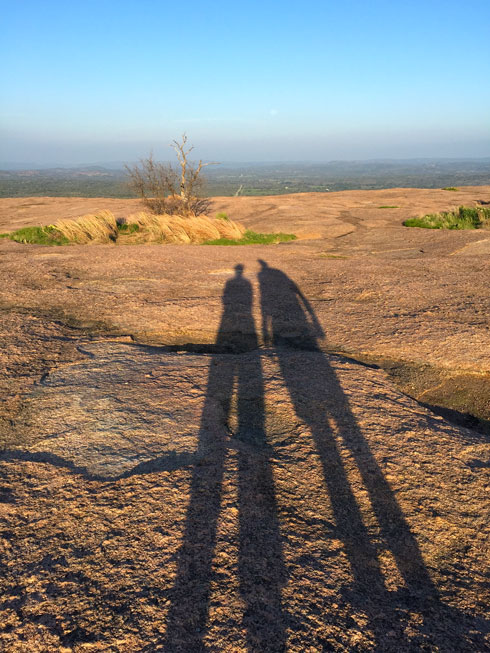 Sun setting, moon rising on top of Enchanted Rock