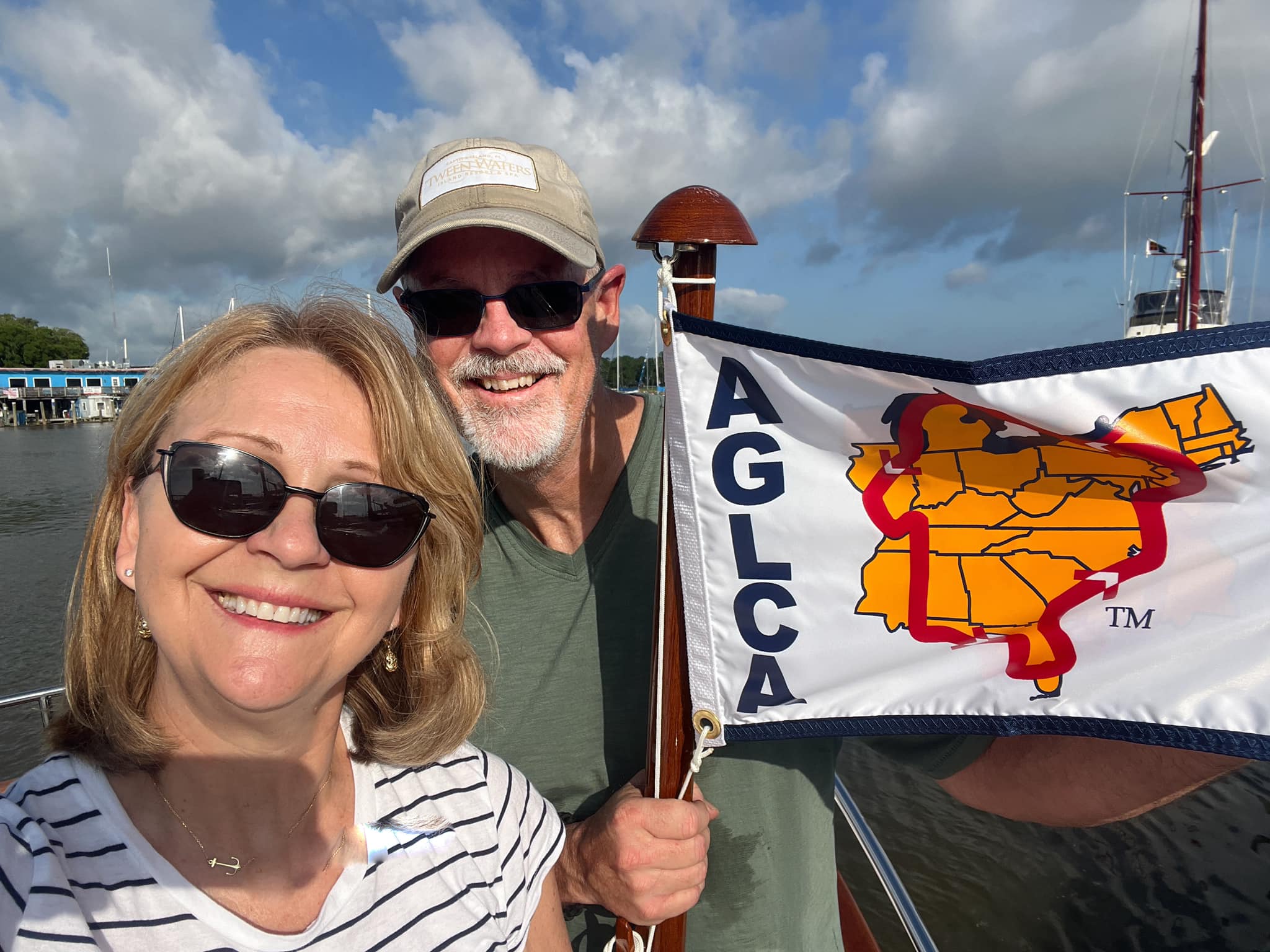 May be an image of 2 people, sail, boat and text